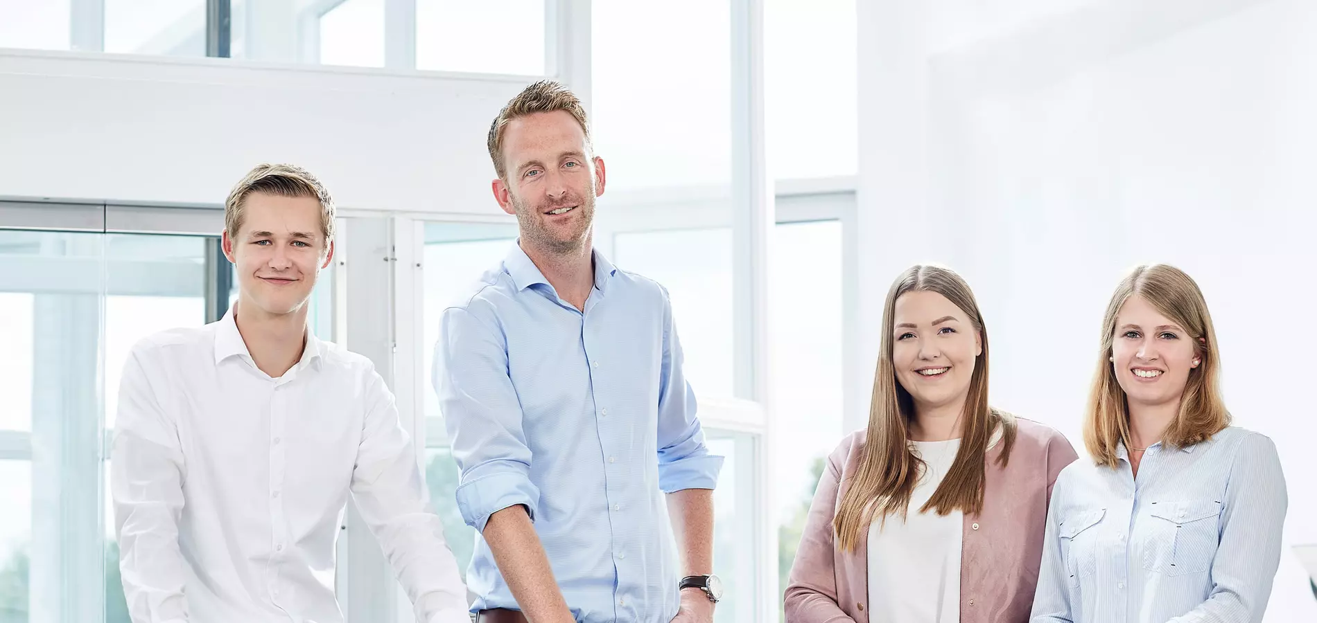 COMPO EXPERT Students standing in office